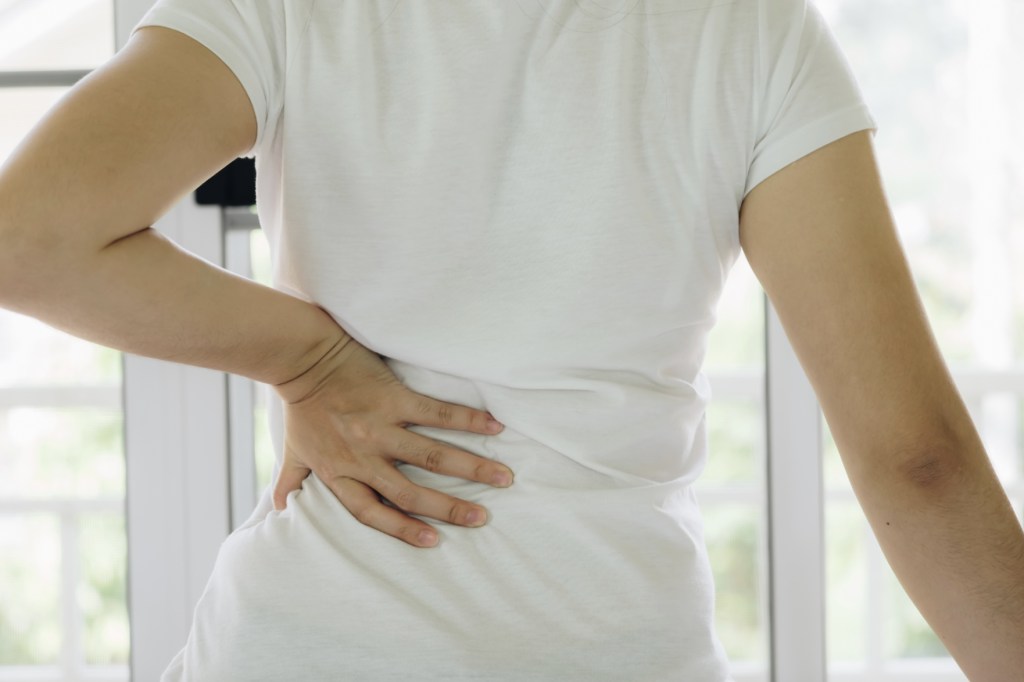 Person experiencing spine back pain